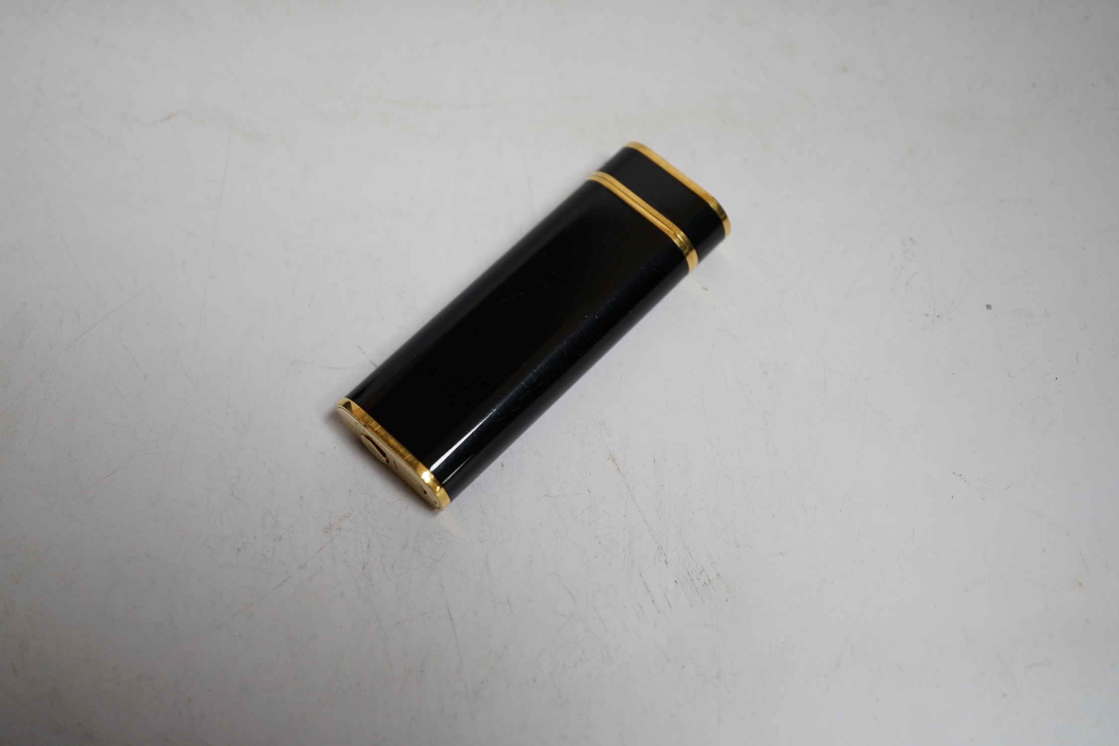 Cartier, black enamel and gold plated lighter